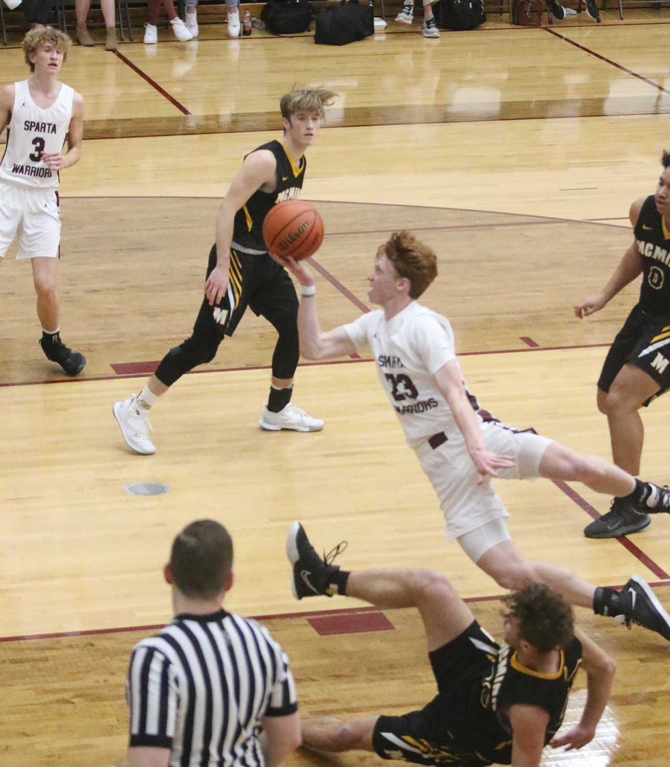 Grant Slatten tries to finish as he gets tripped and fouled.